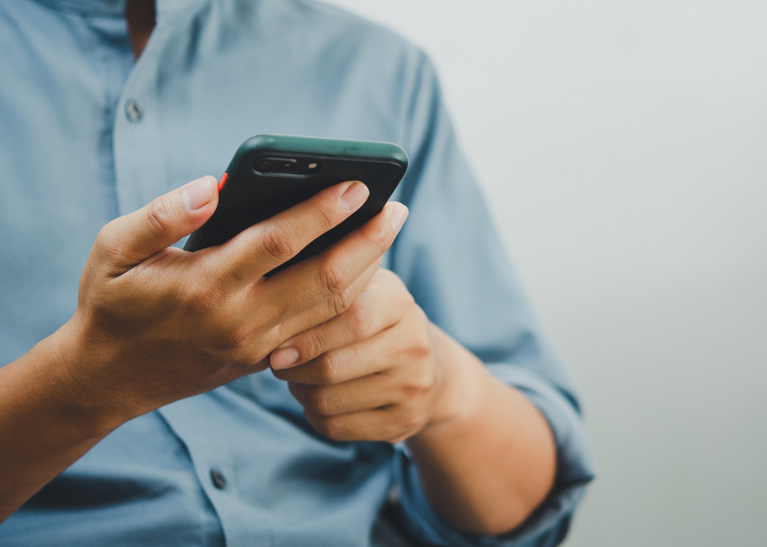 Closeup of person reading message on their phone.