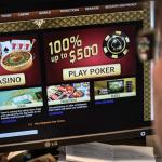 A person looking at a gambling website on a desktop computer.
