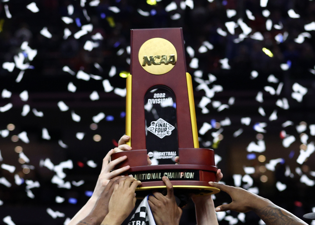 The Kansas Jayhawks celebrate with the 2022 NCAA trophy.